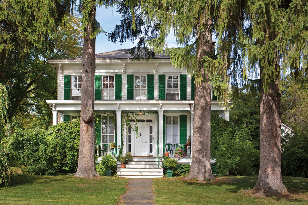 Victorian era home with green shutters